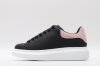 ALEXANDER MCQUEEN oversized black sneakers with rose heel